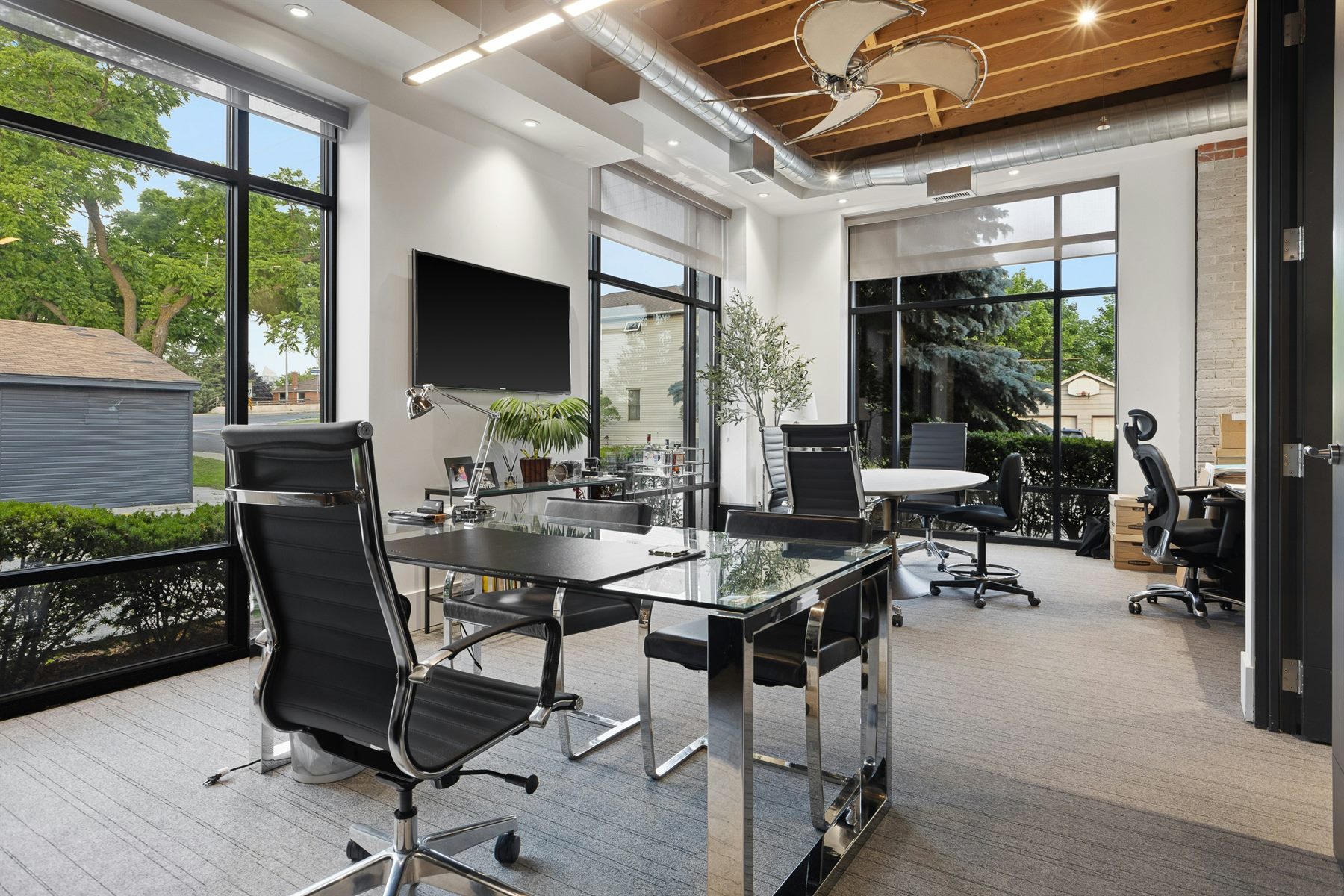 Bright contemporary office with meeting and desk areas