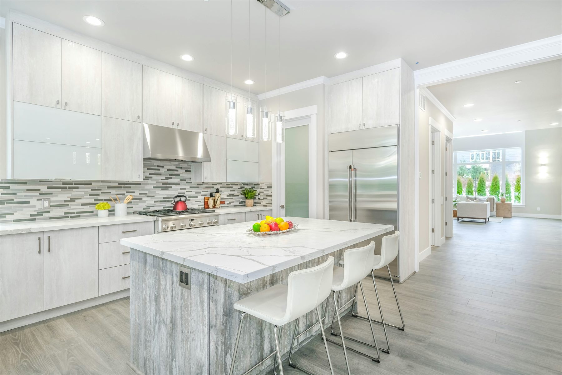 Bright modern kitchen with island and clean work surfaces